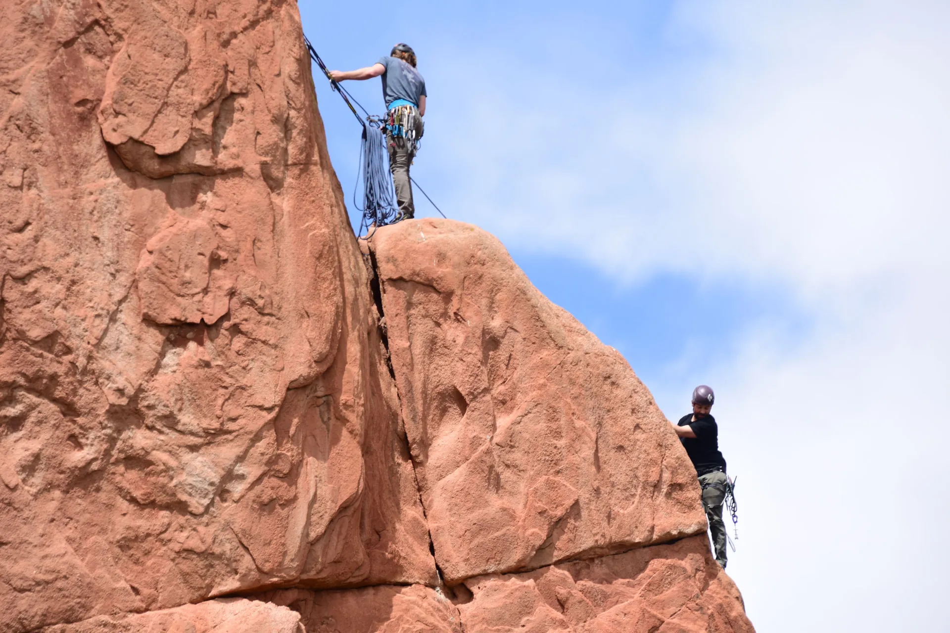 Two climbers on a mountain rock face